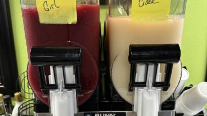 closeup of slushy machine showing farm girl and apple cider flavors