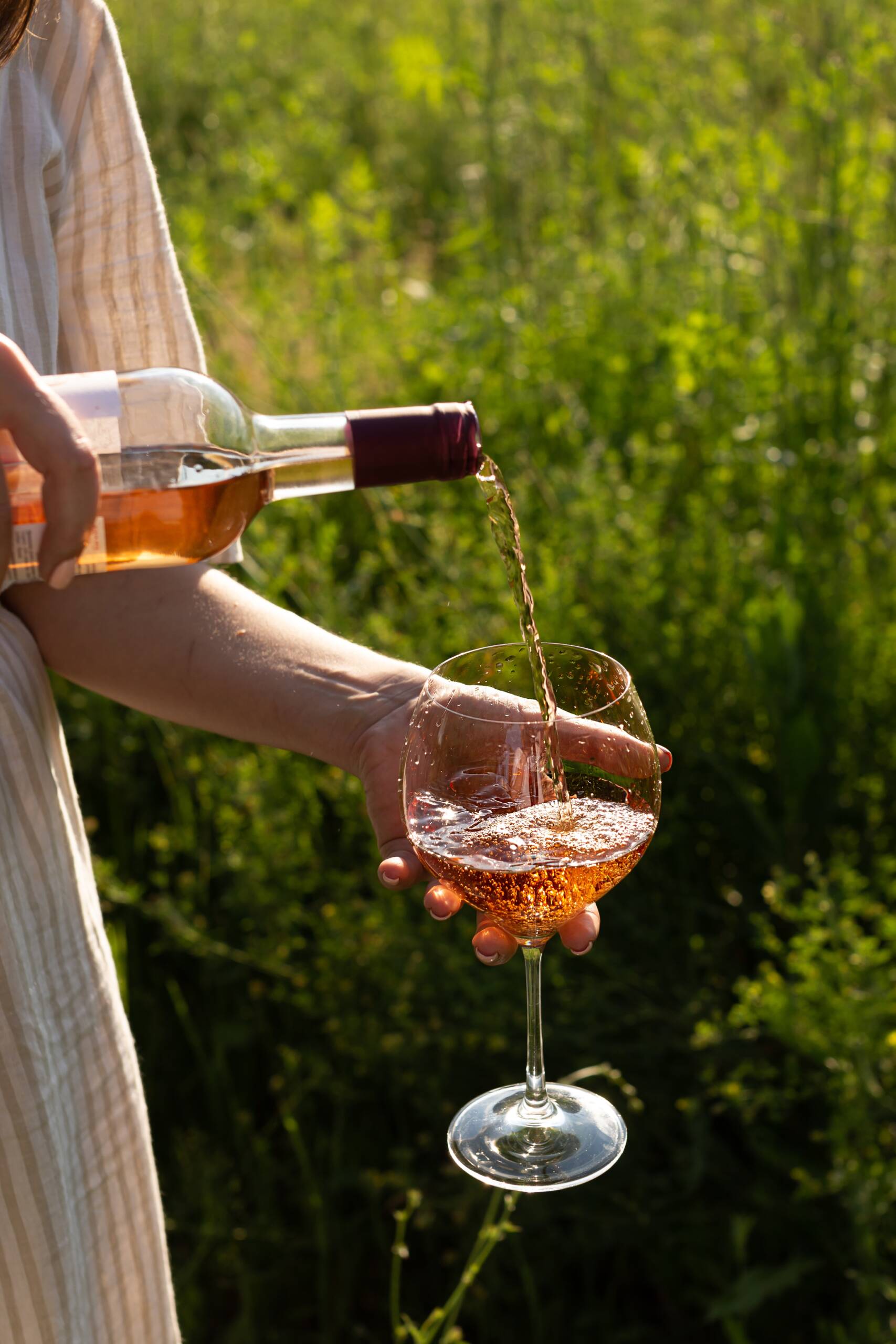 woman pouring a glass of wine